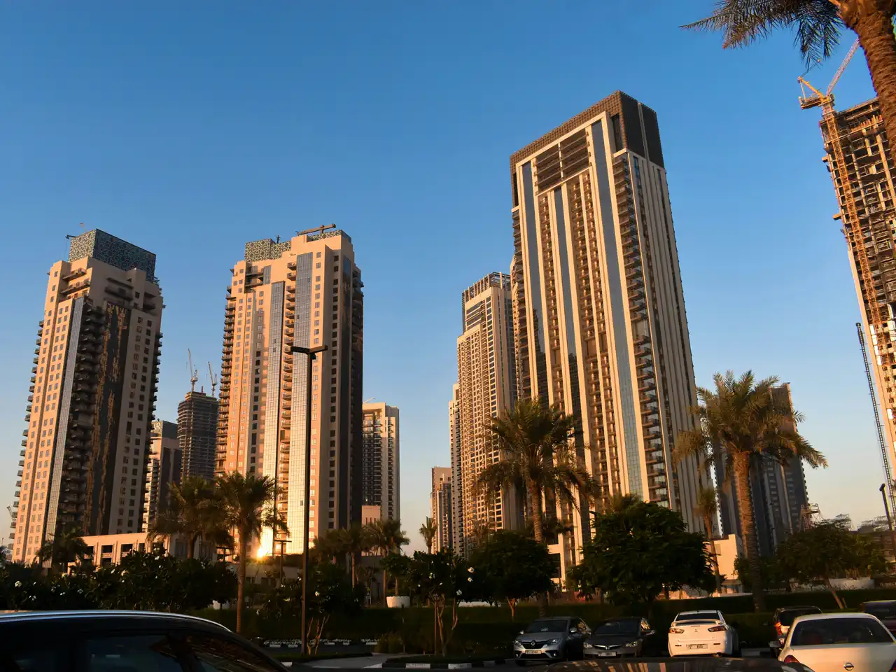 Completed and under-construction residential towers in Dubai Creek Harbour at dusk