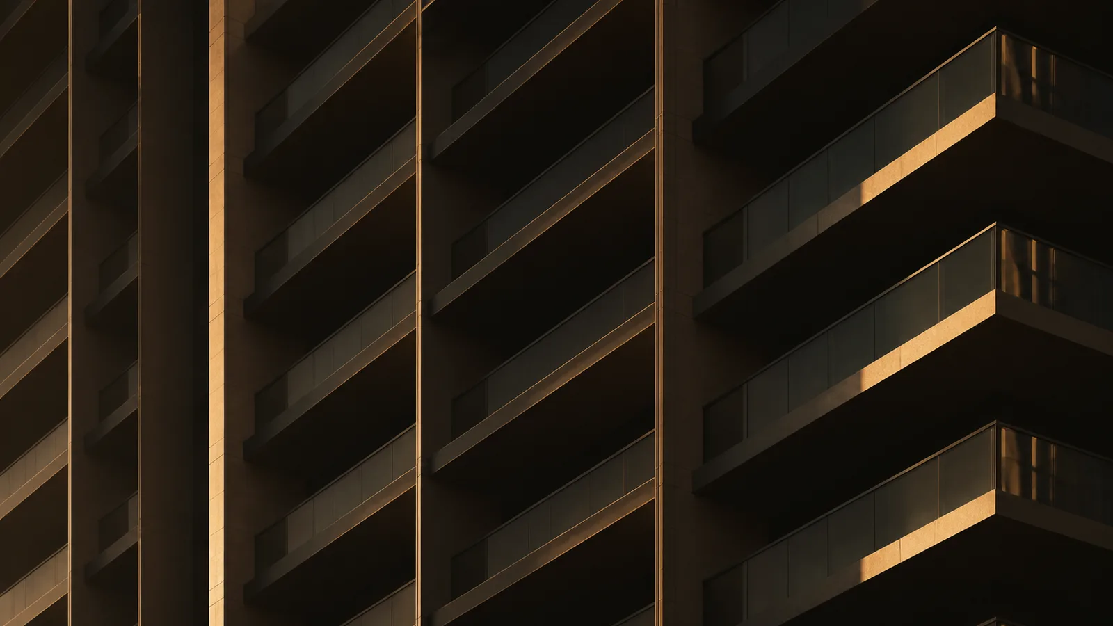 Close-up of Dubai tower balconies in golden light, representing service-charge data