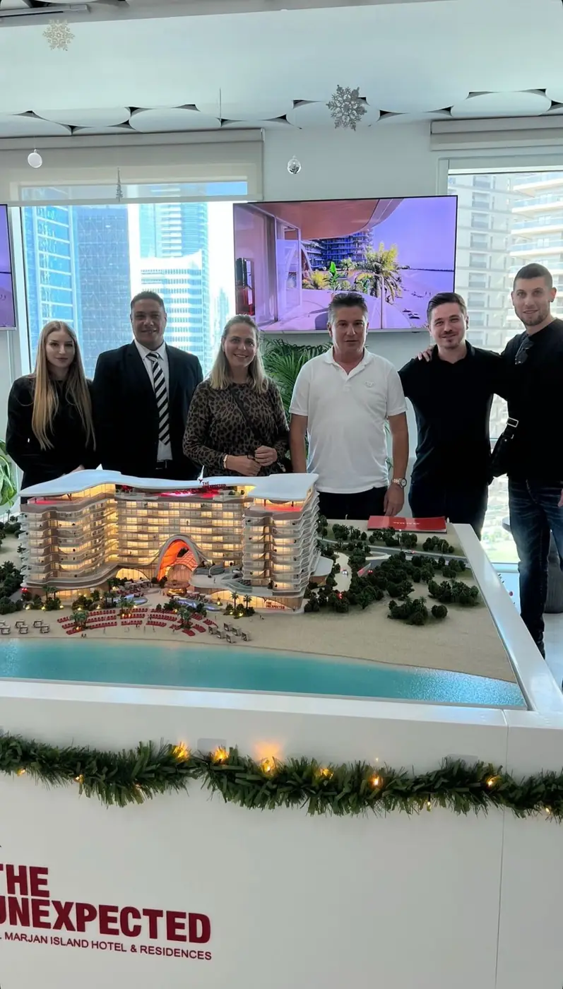Clients and a ProEstate broker at a developer sales gallery in Dubai: Al Marjan Island Hotel & Residences