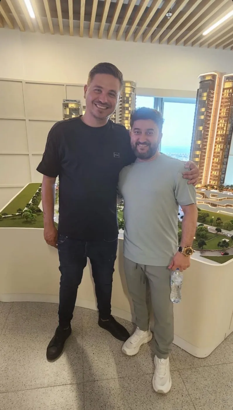 Clients and a ProEstate broker at a developer sales gallery in Dubai: The Orchard Place